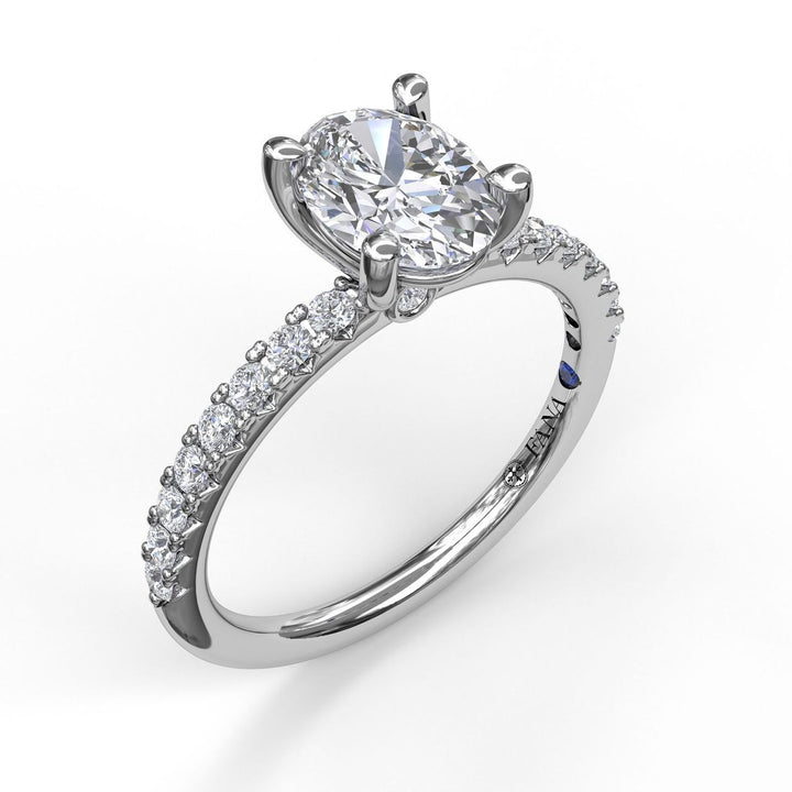 Classic Single Row Engagement ring with an Oval Center Diamond.