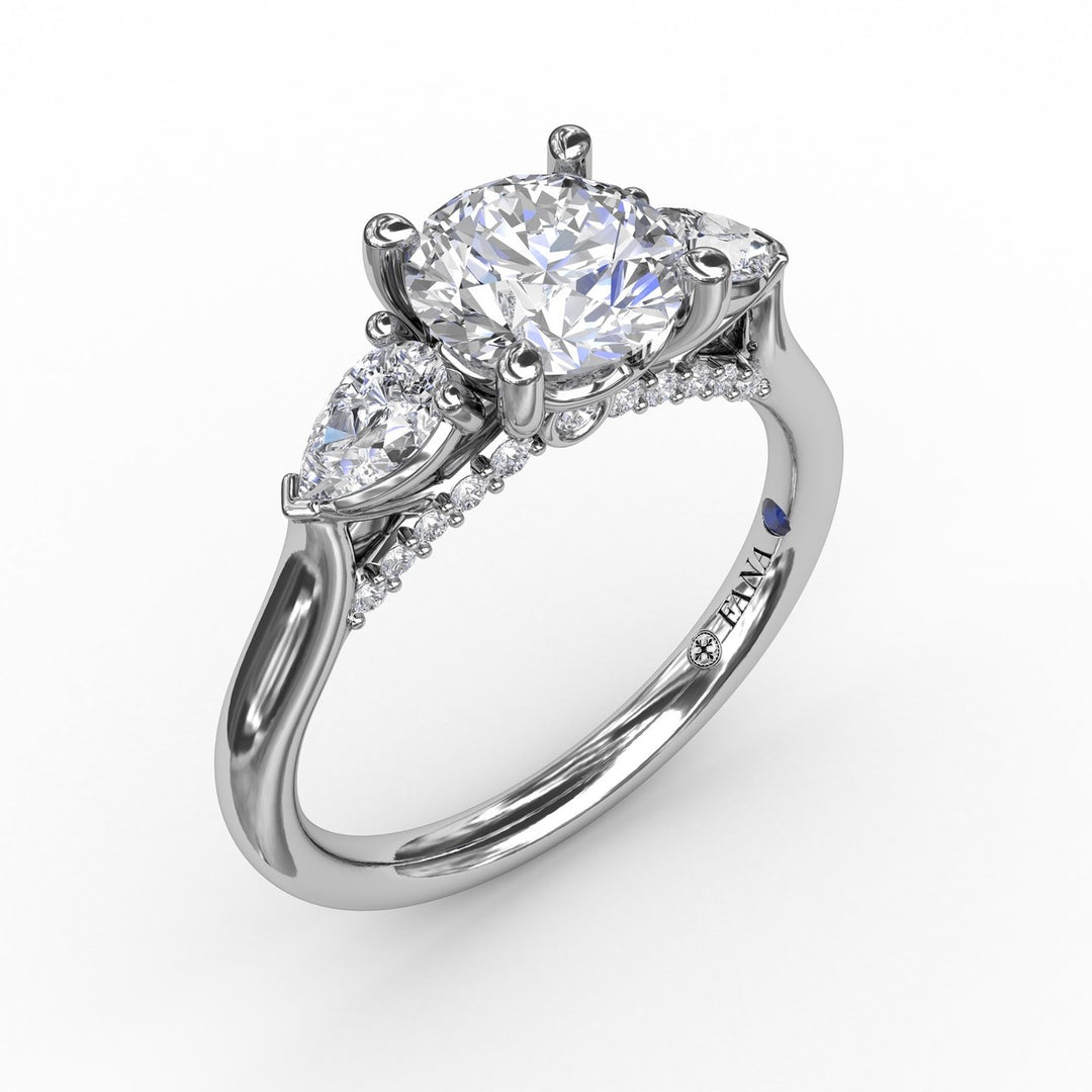 Classic Three-Stone Diamond Engagement Ring With Pear-Shape Side Diamonds