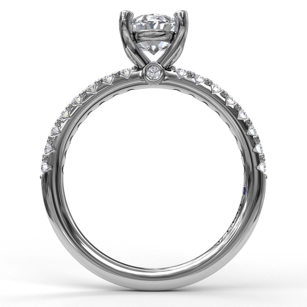 Classic Single Row Engagement ring with an Oval Center Diamond.